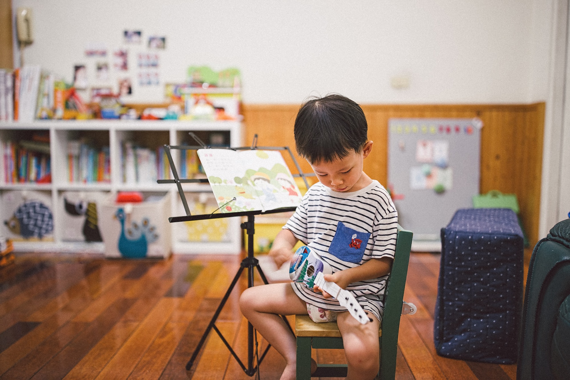 Baby boy playing music